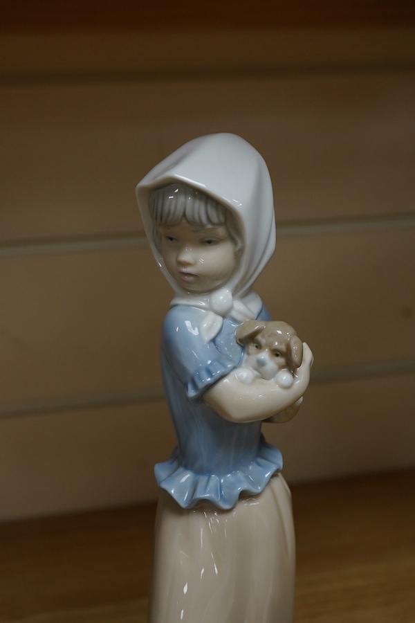 A Royal Doulton Images group and four LLadro figures